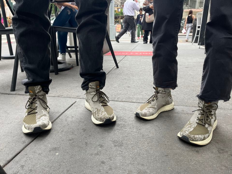 Bennett Collen, left, and Stephanie Howard, right, the cofounders of Endstate, wore matching sneakers to NFT NYC this summer.