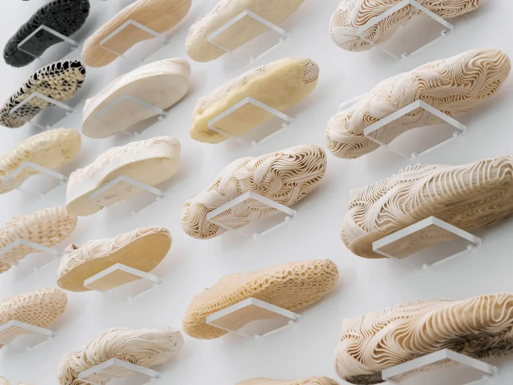 A wall of shoe prototypes designed at the OXMAN lab over the course of a year Image: Nicholas Calcott; Courtesy of OXMAN