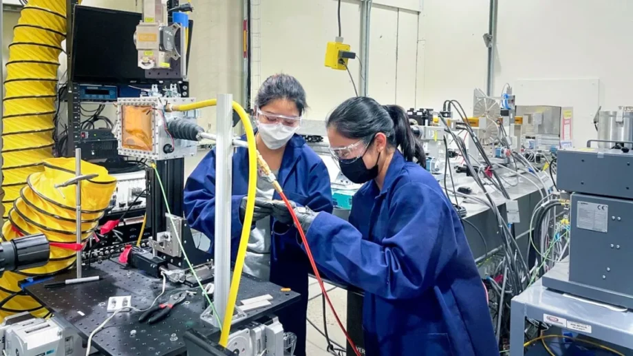 Akane Wakai, Ph.D. ’24, and Jennifer Bustillos, Ph.D. ’24, prepare a sample at the Cornell High Energy Synchrotron Source.