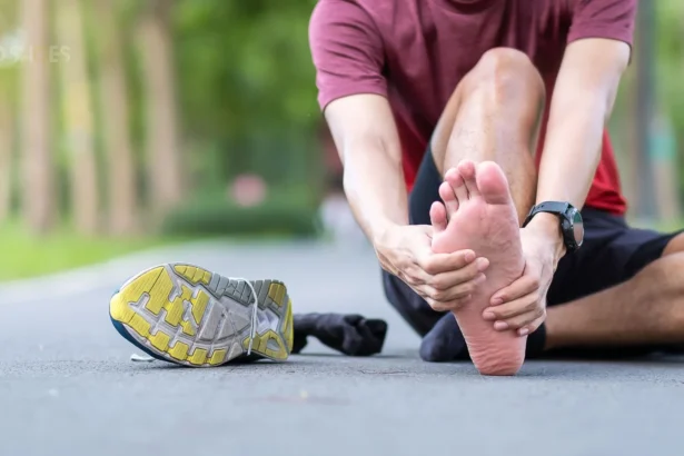 Person massaging their heel to relieve plantar fasciitis pain