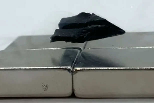 A sample of a superconductor 3D printed from a single seed — this one shaped like a paper airplane — is shown levitating over a magnet. Credit: Dingchang Zhang . Source: Fermilab.