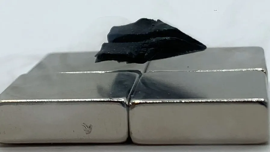 A sample of a superconductor 3D printed from a single seed — this one shaped like a paper airplane — is shown levitating over a magnet. Credit: Dingchang Zhang . Source: Fermilab.