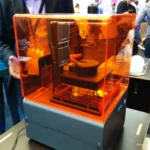 Formlabs Form 1 desktop SLA/DLP printer building a small test geometry