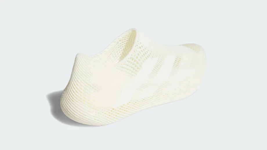 Adidas Climacool Slip‑On — full side view of the cream‑colored, one‑piece 3D‑printed sneaker on a light‑grey background.