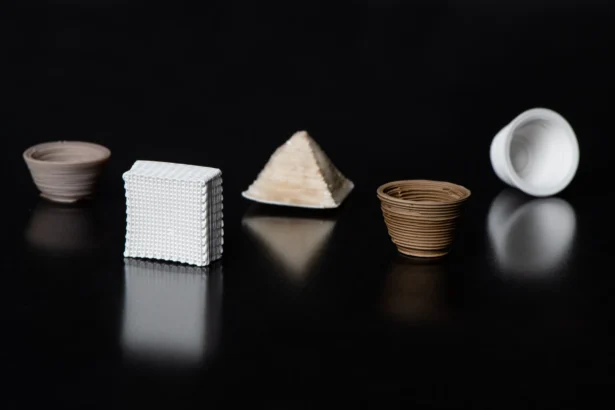 Array of low-temperature 3D-printed glass test shapes created at MIT Lincoln Laboratory