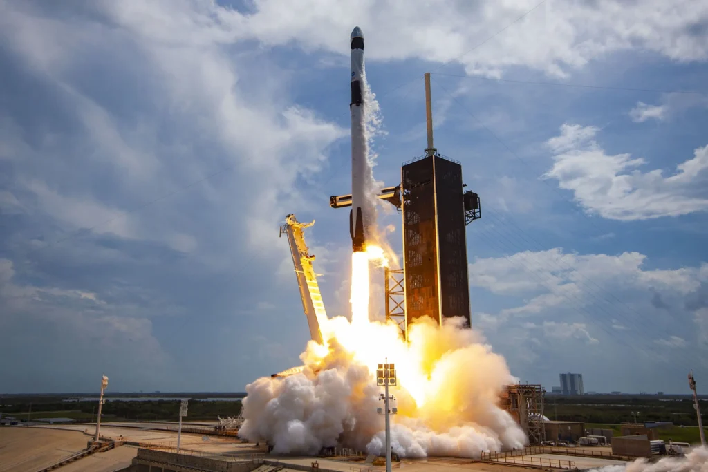 SpaceX Falcon 9 rocket lifting off from the coast