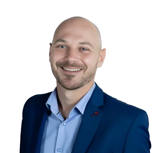 Kuba Graczyk, founder and CEO of Koobz, smiling headshot.