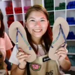 A #MYOH 2018 assistant proudly shows a freshly customized pair featuring a commemorative strap, rose‑gold sole, and “Good Vibes” + “Lit” pins—an ₱1,049 combination that proves personalization is half the fun.
