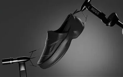 HUGO x Zellerfeld 3D‑printed loafer suspended against a dark gradient background