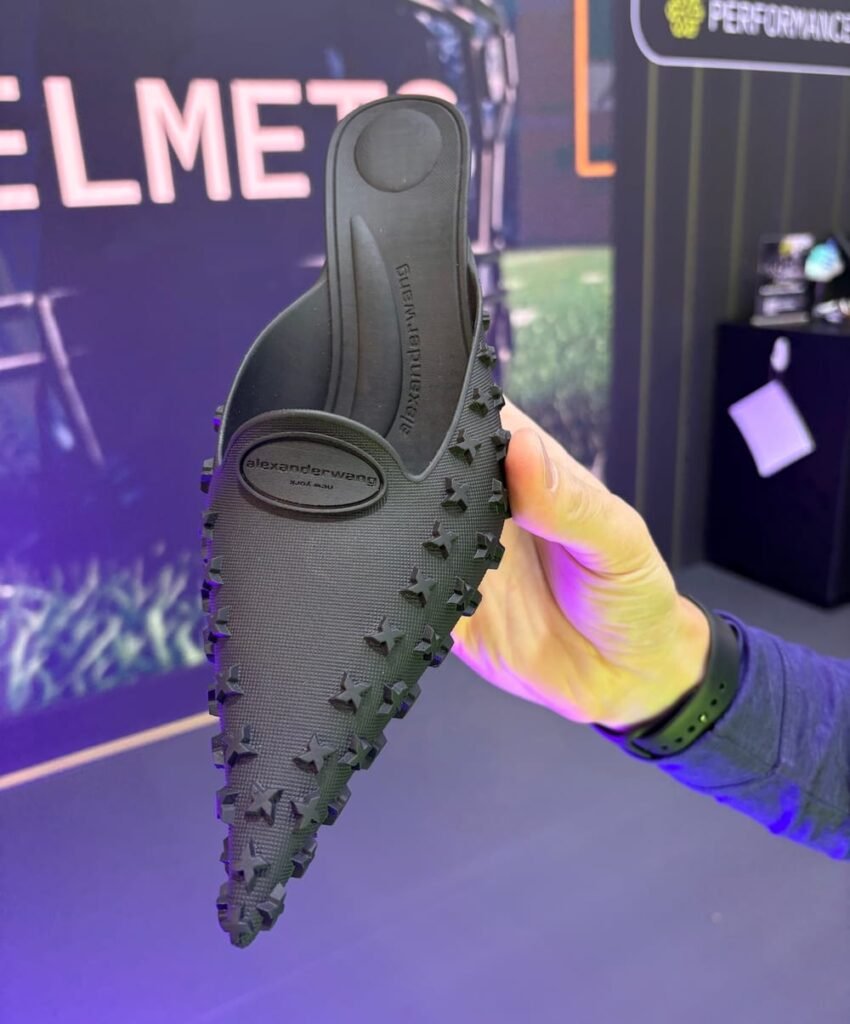 Alexander Wang’s 3D-printed Griphoria kitten heel displayed at Formnext 2025, featuring a black micro-textured upper and lattice footbed.