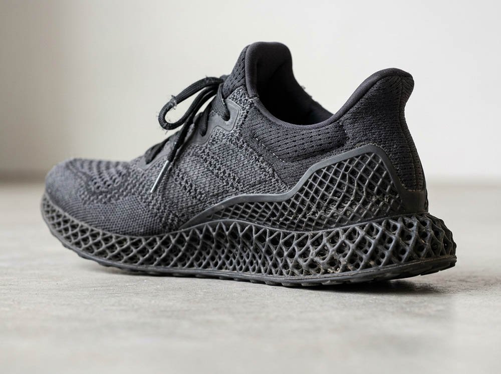 3D printed shoe with lattice midsole showing heel compression and early wear