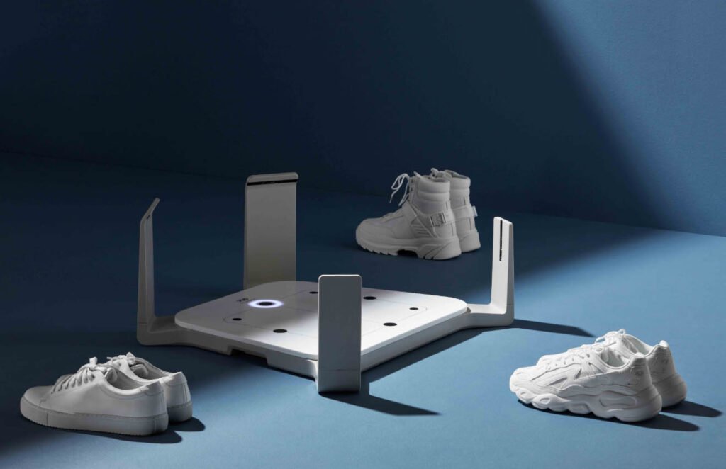 Volumental foot scanning platform displayed with white shoes for scan-to-fit footwear.