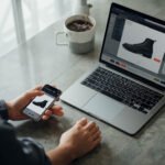 Customer using a smartphone foot scan before buying custom 3D printed shoes with limited returns
